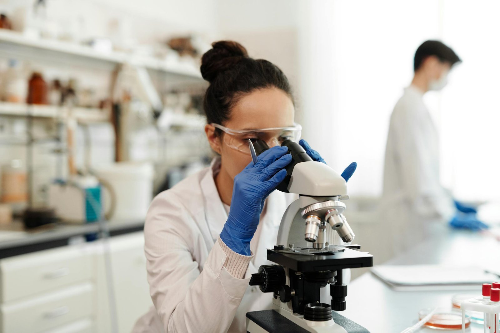 A Woman Using Microscope